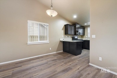 This inviting home features soaring vaulted ceilings upgraded on Hunters Point Golf Club in Idaho - for sale on GolfHomes.com, golf home, golf lot