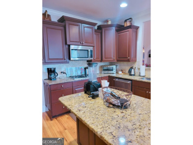 Stunning 7-Bedroom, 5-Bath All-Brick Home in Exclusive Gated on Eagles Landing Country Club in Georgia - for sale on GolfHomes.com, golf home, golf lot