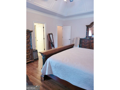 Stunning 7-Bedroom, 5-Bath All-Brick Home in Exclusive Gated on Eagles Landing Country Club in Georgia - for sale on GolfHomes.com, golf home, golf lot