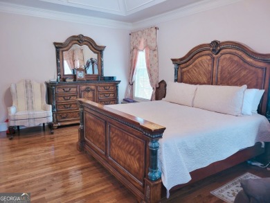 Stunning 7-Bedroom, 5-Bath All-Brick Home in Exclusive Gated on Eagles Landing Country Club in Georgia - for sale on GolfHomes.com, golf home, golf lot