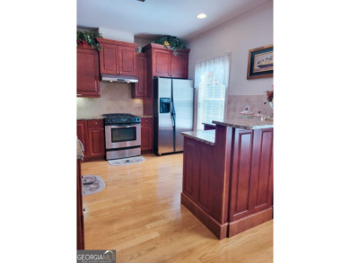 Stunning 7-Bedroom, 5-Bath All-Brick Home in Exclusive Gated on Eagles Landing Country Club in Georgia - for sale on GolfHomes.com, golf home, golf lot