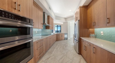 Indulge in spectacular, fully reimagined waterfront living in on Longboat Key Golf Club Resort in Florida - for sale on GolfHomes.com, golf home, golf lot