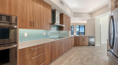 Indulge in spectacular, fully reimagined waterfront living in on Longboat Key Golf Club Resort in Florida - for sale on GolfHomes.com, golf home, golf lot