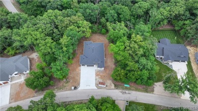 New Construction! This luxurious reverse  1.5 story 5 bedroom/3 on The Club At Porto Cima in Missouri - for sale on GolfHomes.com, golf home, golf lot