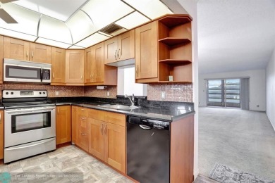 DRAMATICALLY REDUCED, SELLER IS MOTIVATED, Discover this on Wynmoor Golf Course in Florida - for sale on GolfHomes.com, golf home, golf lot
