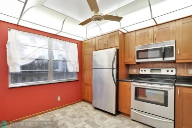 DRAMATICALLY REDUCED, SELLER IS MOTIVATED, Discover this on Wynmoor Golf Course in Florida - for sale on GolfHomes.com, golf home, golf lot