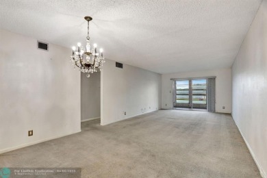 DRAMATICALLY REDUCED, SELLER IS MOTIVATED, Discover this on Wynmoor Golf Course in Florida - for sale on GolfHomes.com, golf home, golf lot