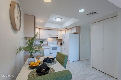 Beautifully maintained end unit condo located in a guard-gated on Scottsdale Shadows in Arizona - for sale on GolfHomes.com, golf home, golf lot