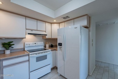 Beautifully maintained end unit condo located in a guard-gated on Scottsdale Shadows in Arizona - for sale on GolfHomes.com, golf home, golf lot