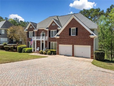 Nestled in the highly sought-after Towne Lake community and on Canongate At Eagle Watch Golf Club in Georgia - for sale on GolfHomes.com, golf home, golf lot