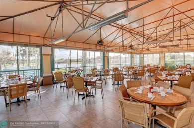 Experience stunning lake views from this beautifully updated on Westchester Golf and Country Club in Florida - for sale on GolfHomes.com, golf home, golf lot