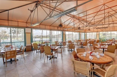 Discover breathtaking lake vistas from this stylishly renovated on Westchester Golf and Country Club in Florida - for sale on GolfHomes.com, golf home, golf lot