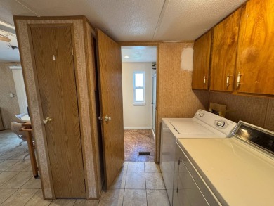 Priced to Sell in Hidden Golf - A Highly Sought-After 55+ Gated on Lake Henry Golf Club in Florida - for sale on GolfHomes.com, golf home, golf lot
