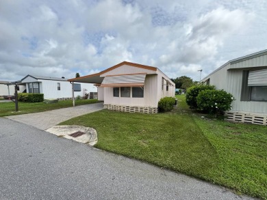 Priced to Sell in Hidden Golf - A Highly Sought-After 55+ Gated on Lake Henry Golf Club in Florida - for sale on GolfHomes.com, golf home, golf lot