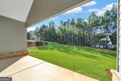 Nestled on the corner lot is an absolute gorgeous new on Canongate At Healy Point Country Club in Georgia - for sale on GolfHomes.com, golf home, golf lot