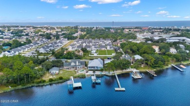 CUSTOM LAKE FRONT HOME WITH PRIVATE DOCK, BOATHOUSE FEATURING 6K on Sharks Tooth Golf Club in Florida - for sale on GolfHomes.com, golf home, golf lot