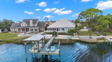 CUSTOM LAKE FRONT HOME WITH PRIVATE DOCK, BOATHOUSE FEATURING 6K on Sharks Tooth Golf Club in Florida - for sale on GolfHomes.com, golf home, golf lot