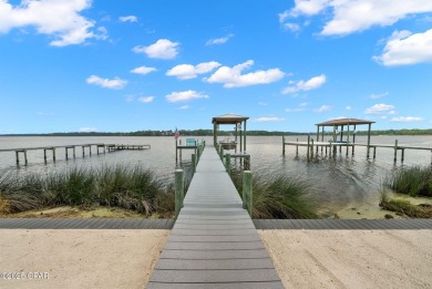 CUSTOM LAKE FRONT HOME WITH PRIVATE DOCK, BOATHOUSE FEATURING 6K on Sharks Tooth Golf Club in Florida - for sale on GolfHomes.com, golf home, golf lot