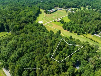 Approximately 1.25 acre gentle sloping lot with mountain views on The Rock At Jocassee in South Carolina - for sale on GolfHomes.com, golf home, golf lot