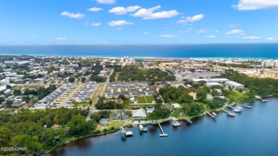 CUSTOM LAKE FRONT HOME WITH PRIVATE DOCK, BOATHOUSE FEATURING 6K on Sharks Tooth Golf Club in Florida - for sale on GolfHomes.com, golf home, golf lot