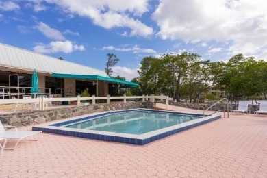 Fabulous modern remodel and premium location with stunning golf on Riverbend Golf Club in Florida - for sale on GolfHomes.com, golf home, golf lot
