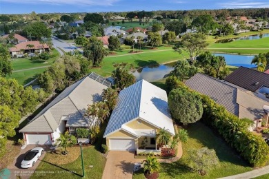 Located in prestigious Boca Woods Country Club this home is move on Boca Woods Country Club in Florida - for sale on GolfHomes.com, golf home, golf lot