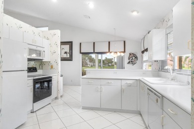 Enjoy STUNNING long lake views from this beautifully maintained on Westchester Golf and Country Club in Florida - for sale on GolfHomes.com, golf home, golf lot