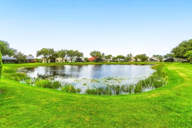 Enjoy STUNNING long lake views from this beautifully maintained on Westchester Golf and Country Club in Florida - for sale on GolfHomes.com, golf home, golf lot