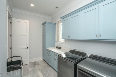 INCREDIBLE CURB APPEAL and stunning green-to-tee views of the #1 on Crow Creek Golf Club in North Carolina - for sale on GolfHomes.com, golf home, golf lot