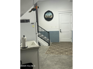 INCREDIBLE CURB APPEAL and stunning green-to-tee views of the #1 on Crow Creek Golf Club in North Carolina - for sale on GolfHomes.com, golf home, golf lot