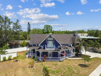 Nestled on a beautifully positioned corner lot directly across on Clearwater Country Club in Florida - for sale on GolfHomes.com, golf home, golf lot