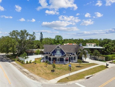 Nestled on a beautifully positioned corner lot directly across on Clearwater Country Club in Florida - for sale on GolfHomes.com, golf home, golf lot