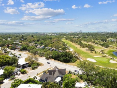 Nestled on a beautifully positioned corner lot directly across on Clearwater Country Club in Florida - for sale on GolfHomes.com, golf home, golf lot