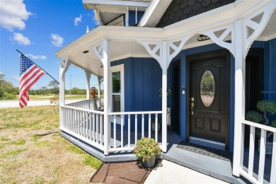 Nestled on a beautifully positioned corner lot directly across on Clearwater Country Club in Florida - for sale on GolfHomes.com, golf home, golf lot