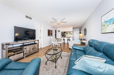 Welcome to this beautifully maintained turnkey 2-bedroom on Isla Del Sol Yacht and Country Club in Florida - for sale on GolfHomes.com, golf home, golf lot