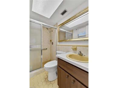 Welcome to this beautifully maintained 3-bedroom, 2-bathroom on San Carlos Golf Club in Florida - for sale on GolfHomes.com, golf home, golf lot