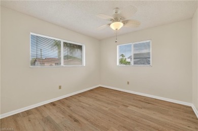 Welcome to this beautifully maintained 3-bedroom, 2-bathroom on San Carlos Golf Club in Florida - for sale on GolfHomes.com, golf home, golf lot