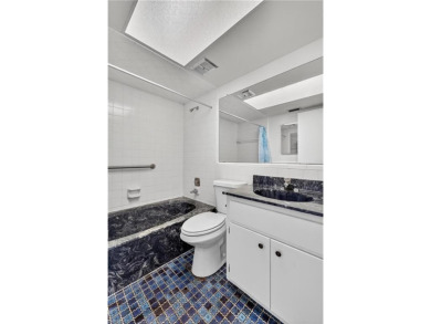 Welcome to this beautifully maintained 3-bedroom, 2-bathroom on San Carlos Golf Club in Florida - for sale on GolfHomes.com, golf home, golf lot
