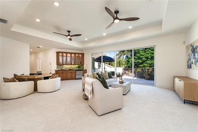 Tucked away on a quiet, tree-lined street in the exclusive on Colliers Reserve Country Club in Florida - for sale on GolfHomes.com, golf home, golf lot