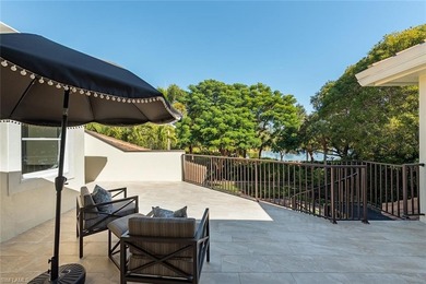 Tucked away on a quiet, tree-lined street in the exclusive on Colliers Reserve Country Club in Florida - for sale on GolfHomes.com, golf home, golf lot