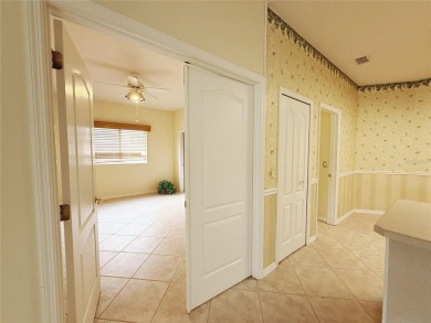 Welcome to this beautifully updated St. Clair model, perfectly on Kings Ridge Golf Club in Florida - for sale on GolfHomes.com, golf home, golf lot