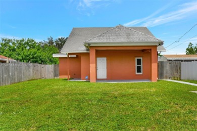 Enjoy this 2-story home built in 2015. No HOA Community. This on Trump International Golf Club West Palm Beach in Florida - for sale on GolfHomes.com, golf home, golf lot