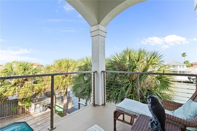 Nestled among palms on Island Moorings' coveted *Shady Side,* on Palmilla Beach Golf Club in Texas - for sale on GolfHomes.com, golf home, golf lot