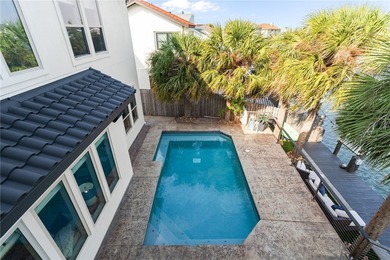 Nestled among palms on Island Moorings' coveted *Shady Side,* on Palmilla Beach Golf Club in Texas - for sale on GolfHomes.com, golf home, golf lot