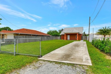 Enjoy this 2-story home built in 2015. No HOA Community. This on Trump International Golf Club West Palm Beach in Florida - for sale on GolfHomes.com, golf home, golf lot