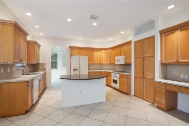 This wonderful single family home has 5 bedrooms & 3 baths w/ a on The Links At Madison Green in Florida - for sale on GolfHomes.com, golf home, golf lot