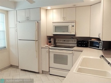 IMMACULATE FURNISHED TURN-KEY 2BR/2BTH! OPEN KITCHEN CONCEPT on Wynmoor Golf Course in Florida - for sale on GolfHomes.com, golf home, golf lot