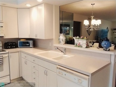 IMMACULATE FURNISHED TURN-KEY 2BR/2BTH! OPEN KITCHEN CONCEPT on Wynmoor Golf Course in Florida - for sale on GolfHomes.com, golf home, golf lot