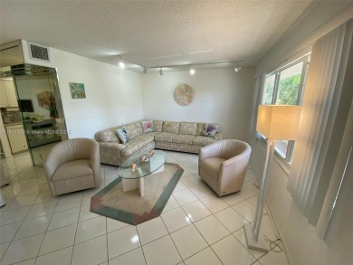 WATER VIEW! 2 BED, 2 BATH GROUND FLOOR UNIT. WASHER AND DRYER on Inverrary Country Club in Florida - for sale on GolfHomes.com, golf home, golf lot