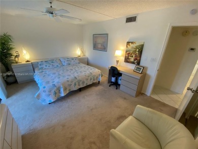 WATER VIEW! 2 BED, 2 BATH GROUND FLOOR UNIT. WASHER AND DRYER on Inverrary Country Club in Florida - for sale on GolfHomes.com, golf home, golf lot